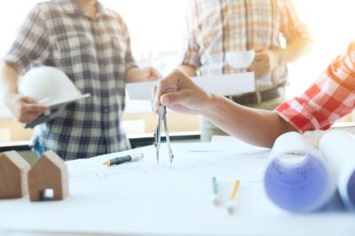teamwork-off-engineer-meeting-architectural-project-min